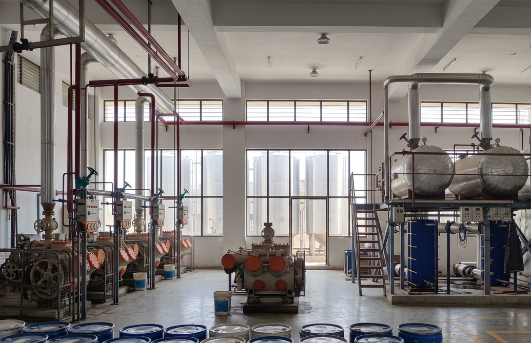 Industrial chiller plant with reciprocating compressors and plate heat exchangers — ATMAN HVAC & Utility